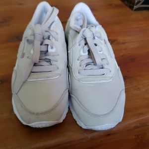 Tan and grey Reebok classic sneakers